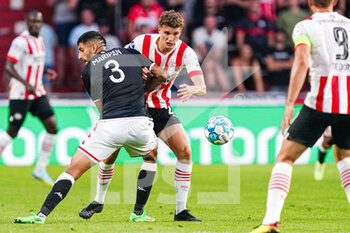 2022-08-09 - Guillermo Maripan of AS Monaco, Guus Til of PSV Eindhoven during the UEFA Champions League, Third qualifying round, 2nd leg football match between PSV Eindhoven and AS Monaco on August 9, 2022 at Philips Stadion in Eindhoven, Netherlands - FOOTBALL - CHAMPIONS LEAGUE - PSV EINDHOVEN V MONACO - UEFA CHAMPIONS LEAGUE - SOCCER