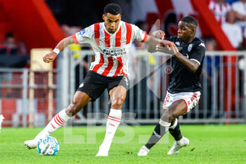 2022-08-09 - Cody Gakpo of PSV Eindhoven, Eliot Matazo of AS Monaco during the UEFA Champions League, Third qualifying round, 2nd leg football match between PSV Eindhoven and AS Monaco on August 9, 2022 at Philips Stadion in Eindhoven, Netherlands - FOOTBALL - CHAMPIONS LEAGUE - PSV EINDHOVEN V MONACO - UEFA CHAMPIONS LEAGUE - SOCCER