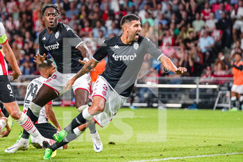 2022-08-09 - Guillermo Maripan of AS Monaco celebrates after scoring a goal 1-1 with Axel Disasi during the UEFA Champions League, Third qualifying round, 2nd leg football match between PSV Eindhoven and AS Monaco on August 9, 2022 at Philips Stadion in Eindhoven, Netherlands - FOOTBALL - CHAMPIONS LEAGUE - PSV EINDHOVEN V MONACO - UEFA CHAMPIONS LEAGUE - SOCCER