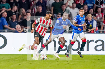 2022-08-24 - Cody Gakpo of PSV, Glen Kamara of Rangers during the UEFA Champions League, Play-Off Second Leg football match between PSV and Rangers on August 24, 2022 at the Philips Stadion in Eindhoven, Netherlands - FOOTBALL - CHAMPIONS LEAGUE - PSV V RANGERS - UEFA CHAMPIONS LEAGUE - SOCCER