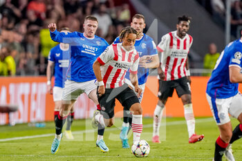 2022-08-24 - John Lundstram of Rangers, Xavi Simons of PSV during the UEFA Champions League, Play-Off Second Leg football match between PSV and Rangers on August 24, 2022 at the Philips Stadion in Eindhoven, Netherlands - FOOTBALL - CHAMPIONS LEAGUE - PSV V RANGERS - UEFA CHAMPIONS LEAGUE - SOCCER