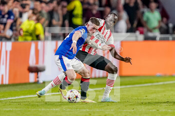 2022-08-24 - Ryan Kent of Rangers, Jordan Teze of PSV during the UEFA Champions League, Play-Off Second Leg football match between PSV and Rangers on August 24, 2022 at the Philips Stadion in Eindhoven, Netherlands - FOOTBALL - CHAMPIONS LEAGUE - PSV V RANGERS - UEFA CHAMPIONS LEAGUE - SOCCER