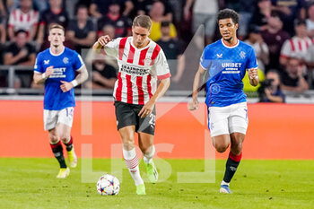 2022-08-24 - Joey Veerman of PSV, Malik Tillman of Rangers during the UEFA Champions League, Play-Off Second Leg football match between PSV and Rangers on August 24, 2022 at the Philips Stadion in Eindhoven, Netherlands - FOOTBALL - CHAMPIONS LEAGUE - PSV V RANGERS - UEFA CHAMPIONS LEAGUE - SOCCER
