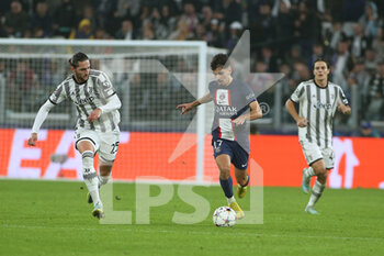 2022-11-02 - Vitinha (Paris Saint-Germain) in action against Adrien Rabiot (Juventus FC) - JUVENTUS FC VS PARIS SAINT-GERMAIN FC - UEFA CHAMPIONS LEAGUE - SOCCER