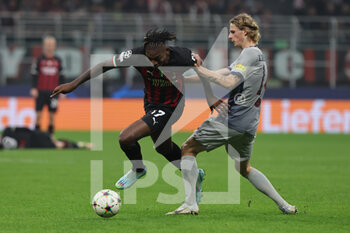 2022-11-02 - Rafael Leao of AC Milan competes for the ball with Maurits Kjærgard of FC Red Bull Salzburg during UEFA Champions League 2022/23 Group Stage - Group E football match between AC Milan and FC Red Bull Salzburg at Giuseppe Meazza Stadium, Milan, Italy on November 02, 2022 - AC MILAN VS FC RED BULL SALZBURG - UEFA CHAMPIONS LEAGUE - SOCCER