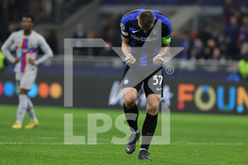 2022-10-04 - Milan Skriniar of FC Internazionale celebrates the victory at the end of the match during the UEFA Champions League 2022/23 Group Stage - Group C football match between FC Internazionale and FC Barcelona at Giuseppe Meazza Stadium, Milan, Italy on October 04, 2022 - INTER - FC INTERNAZIONALE VS FC BARCELONA - UEFA CHAMPIONS LEAGUE - SOCCER