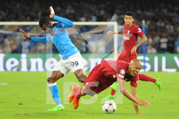 2022-09-07 - Andre Frank Zambo Anguissa and Fabinho of Liverpool FC competes for the ball during the Uefa Champions League match between SSC Napoli vs FC Liverpool  at Diego Armando Maradona Stadium  - SSN NAPOLI VS LIVERPOOL FC - UEFA CHAMPIONS LEAGUE - SOCCER