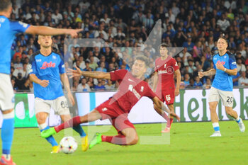 2022-09-07 - Roberto Firmino of Liverpool FC competes for the ball with  Stanislav Lobotka SSC Napoli during the Uefa Champions League match between SSC Napoli vs FC Liverpool  at Diego Armando Maradona Stadium  - SSN NAPOLI VS LIVERPOOL FC - UEFA CHAMPIONS LEAGUE - SOCCER