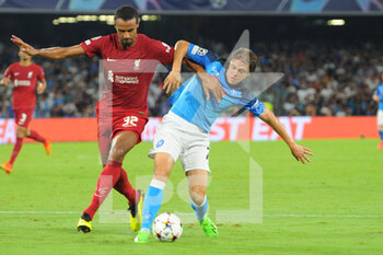 2022-09-07 - Joel Matip of Liverpool FC competes for the ball with Alessandro Zanoli SSC Napoli  during the Uefa Champions League match between SSC Napoli vs FC Liverpool  at Diego Armando Maradona Stadium  - SSN NAPOLI VS LIVERPOOL FC - UEFA CHAMPIONS LEAGUE - SOCCER
