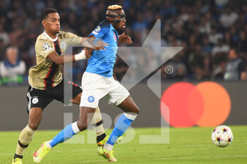 2022-10-12 - Victor Osimhen of SSC Napoli  and Jurrien Timber FC Ajax competes for the ball with during the Uefa Champions League  SSC Napoli and AFC Ajax  at Diego Armando Maradona Stadium - SSN NAPOLI VS AFC AJAX - UEFA CHAMPIONS LEAGUE - SOCCER