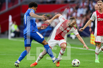 2022-09-07 - Malik Tillman of Rangers, Daley Blind of Ajax during the UEFA Champions League match between Ajax and Rangers at the Johan Cruijff ArenA on September 7, 2022 in Amsterdam, Netherlands - FOOTBALL - CHAMPIONS LEAGUE - AJAX V RANGERS - UEFA CHAMPIONS LEAGUE - SOCCER