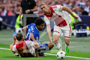 2022-09-07 - Malik Tillman of Rangers, Daley Blind of Ajax, Kenneth Taylor of Ajax during the UEFA Champions League match between Ajax and Rangers at the Johan Cruijff ArenA on September 7, 2022 in Amsterdam, Netherlands - FOOTBALL - CHAMPIONS LEAGUE - AJAX V RANGERS - UEFA CHAMPIONS LEAGUE - SOCCER