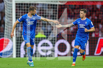 2022-09-07 - Borna Barisic of Rangers, Ryan Jack of Rangers celebrate their first goal during the UEFA Champions League match between Ajax and Rangers at the Johan Cruijff ArenA on September 7, 2022 in Amsterdam, Netherlands - FOOTBALL - CHAMPIONS LEAGUE - AJAX V RANGERS - UEFA CHAMPIONS LEAGUE - SOCCER