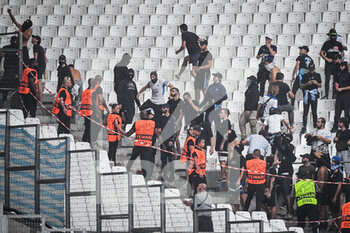 2022-09-13 - Supporters of Marseille with security guards during the UEFA Champions League, Group D football match between Olympique de Marseille and Eintracht Frankfurt on September 13, 2022 at Orange Velodrome stadium in Marseille, France - FOOTBALL - CHAMPIONS LEAGUE - OM V EINTRACHT FRANKFURT - UEFA CHAMPIONS LEAGUE - SOCCER