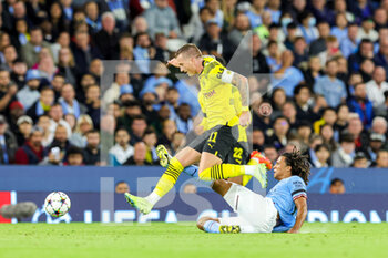 2022-09-14 - Nathan Ake (6) of Manchester City slides in and tackles Marco Reus (11) of Borussia Dortmund during the Champions League match between Manchester City and Borussia Dortmund at the Etihad Stadium, Manchester, England on 14 September 2022. Photo Nigel Keene/ ProSportsImages / DPPI - FOOTBALL - CHAMPIONS LEAGUE - MANCHESTER CITY V BORUSSIA DORTMUND - UEFA CHAMPIONS LEAGUE - SOCCER