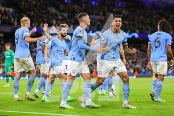 2022-09-14 - Goal 2-1 Erling Haaland (9) of Manchester City scores a goal and shows a muted celebration respecting the Borussia Dortmund fans Joao Cancelo (7) of Manchester City celebrates to the home fans during the Champions League match between Manchester City and Borussia Dortmund at the Etihad Stadium, Manchester, England on 14 September 2022. Photo Nigel Keene/ ProSportsImages / DPPI - FOOTBALL - CHAMPIONS LEAGUE - MANCHESTER CITY V BORUSSIA DORTMUND - UEFA CHAMPIONS LEAGUE - SOCCER