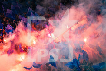 2022-10-04 - Rangers fans, supporters light flares before kick-off during the UEFA Champions League, Group A football match between Liverpool and Rangers on October 4, 2022 at Anfield stadium in Liverpool, England - FOOTBALL - CHAMPIONS LEAGUE - LIVERPOOL V RANGERS - UEFA CHAMPIONS LEAGUE - SOCCER