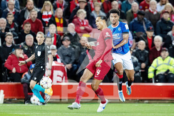 2022-10-04 - Liverpool defender Virgil van Dijk (4) and Malik Tillman of Rangers during the UEFA Champions League, Group A football match between Liverpool and Rangers on October 4, 2022 at Anfield stadium in Liverpool, England - FOOTBALL - CHAMPIONS LEAGUE - LIVERPOOL V RANGERS - UEFA CHAMPIONS LEAGUE - SOCCER