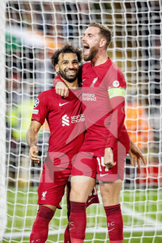 2022-10-04 - Liverpool forward Mohamed Salah (11) celebrates his goal 2-0 with Jordan Henderson during the UEFA Champions League, Group A football match between Liverpool and Rangers on October 4, 2022 at Anfield stadium in Liverpool, England - FOOTBALL - CHAMPIONS LEAGUE - LIVERPOOL V RANGERS - UEFA CHAMPIONS LEAGUE - SOCCER