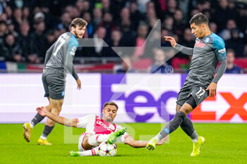 2022-10-04 - Devyne Rensch of Ajax, Mathias Olivera of Napoli during the UEFA Champions League, Group A football match between Ajax and Napoli on October 4, 2022 at Johan Cruijff ArenA in Amsterdam, Netherlands - FOOTBALL - CHAMPIONS LEAGUE - AJAX V NAPOLI - UEFA CHAMPIONS LEAGUE - SOCCER