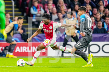 2022-10-04 - Mohammed Kudus of Ajax, Mathias Olivera of Napoli during the UEFA Champions League, Group A football match between Ajax and Napoli on October 4, 2022 at Johan Cruijff ArenA in Amsterdam, Netherlands - FOOTBALL - CHAMPIONS LEAGUE - AJAX V NAPOLI - UEFA CHAMPIONS LEAGUE - SOCCER