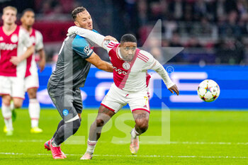 2022-10-04 - Amir Rrahmani of Napoli, Steven Bergwijn of Ajax during the UEFA Champions League, Group A football match between Ajax and Napoli on October 4, 2022 at Johan Cruijff ArenA in Amsterdam, Netherlands - FOOTBALL - CHAMPIONS LEAGUE - AJAX V NAPOLI - UEFA CHAMPIONS LEAGUE - SOCCER