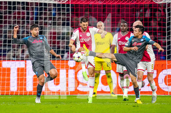 2022-10-04 - Florian Grillitsch of Ajax and Giovanni Simeone, Hirving Lozano of Napoli during the UEFA Champions League, Group A football match between Ajax and Napoli on October 4, 2022 at Johan Cruijff ArenA in Amsterdam, Netherlands - FOOTBALL - CHAMPIONS LEAGUE - AJAX V NAPOLI - UEFA CHAMPIONS LEAGUE - SOCCER