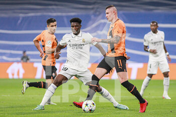 2022-10-05 - Aurelien Tchouameni of Real Madrid and Oleksandr Zubkov of Shakhtar during the UEFA Champions League, Group F, football match between Real Madrid and Shakhtar Donetsk on October 5, 2022 at Santiago Bernabeu stadium in Madrid, Spain - FOOTBALL - CHAMPIONS LEAGUE - REAL MADRID V SHAKHTAR DONETSK - UEFA CHAMPIONS LEAGUE - SOCCER