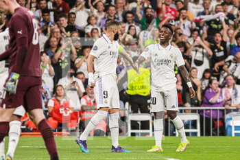 2022-10-05 - Vinicius Junior of Real Madrid celebrates a goal 2-0 with Karim Benzema during the UEFA Champions League, Group F, football match between Real Madrid and Shakhtar Donetsk on October 5, 2022 at Santiago Bernabeu stadium in Madrid, Spain - FOOTBALL - CHAMPIONS LEAGUE - REAL MADRID V SHAKHTAR DONETSK - UEFA CHAMPIONS LEAGUE - SOCCER