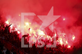 2022-10-11 - Flares among supporters of Benfica during the UEFA Champions League, Group H football match between Paris Saint-Germain and SL Benfica (Lisbon) on October 11, 2022 at Parc des Princes stadium in Paris, France - FOOTBALL - CHAMPIONS LEAGUE - PARIS SG V BENFICA - UEFA CHAMPIONS LEAGUE - SOCCER