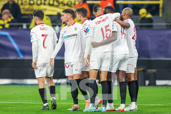 2022-10-11 - Nianzou Tanguy Kouassi of Sevilla celebrates after his goal with teammates during the UEFA Champions League, Group G football match between Borussia Dortmund and Sevilla FC on October 11, 2022 at Signal Iduna Park in Dortmund, Germany - FOOTBALL - CHAMPIONS LEAGUE - BORUSSIA DORTMUND V SEVILLA - UEFA CHAMPIONS LEAGUE - SOCCER