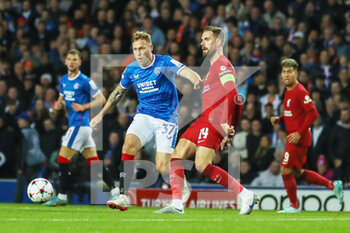 2022-10-12 - Jordan Henderson of Liverpool, Scott Arfield of Rangers during the UEFA Champions League, Group A football match between Rangers and Liverpool on October 12, 2022 at Ibrox stadium in Glasgow, Scotland - FOOTBALL - CHAMPIONS LEAGUE - RANGERS V LIVERPOOL - UEFA CHAMPIONS LEAGUE - SOCCER