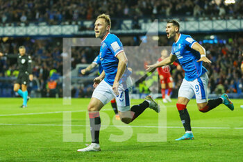2022-10-12 - Scott Arfield of Rangers celebrates his goal 1-0 during the UEFA Champions League, Group A football match between Rangers and Liverpool on October 12, 2022 at Ibrox stadium in Glasgow, Scotland - FOOTBALL - CHAMPIONS LEAGUE - RANGERS V LIVERPOOL - UEFA CHAMPIONS LEAGUE - SOCCER