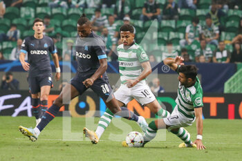 2022-10-12 - Nuno Tavares of Olympique Marseille and Marcus Edwards, Ricardo Esgaio of Sporting Club Portugal during the UEFA Champions League, Group D football match between Sporting CP and Olympique de Marseille on October 12, 2022 at Jose Alvalade stadium in Lisbon, Portugal - FOOTBALL - CHAMPIONS LEAGUE - SPORTING V MARSEILLE - UEFA CHAMPIONS LEAGUE - SOCCER