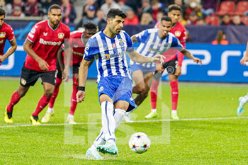 2022-10-12 - Mehdi Taremi of FC Porto takes a penalty during the UEFA Champions League, Group B football match between Bayer 04 Leverkusen and FC Porto on October 12, 2022 at the BayArena in Leverkusen, Germany - FOOTBALL - CHAMPIONS LEAGUE - BAYER LEVERKUSEN V FC PORTO - UEFA CHAMPIONS LEAGUE - SOCCER