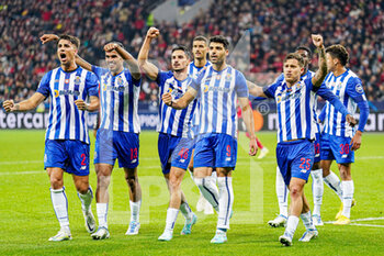 2022-10-12 - Otavio of FC Porto, Mehdi Taremi of FC Porto, players of FC Porto celebrate the third goal during the UEFA Champions League, Group B football match between Bayer 04 Leverkusen and FC Porto on October 12, 2022 at the BayArena in Leverkusen, Germany - FOOTBALL - CHAMPIONS LEAGUE - BAYER LEVERKUSEN V FC PORTO - UEFA CHAMPIONS LEAGUE - SOCCER