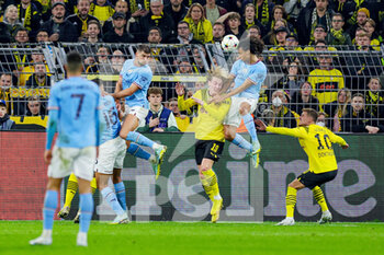 2022-10-25 - Nathan Ake (6) of Manchester City and Julian Brandt of Borussia Dortmund during the UEFA Champions League, Group G football match between Borussia Dortmund and Manchester City on October 25, 2022 at Signal Iduna Park in Dortmund, Germany - FOOTBALL - CHAMPIONS LEAGUE - DORTMUND V MANCHESTER CITY - UEFA CHAMPIONS LEAGUE - SOCCER