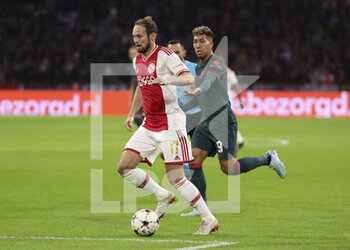 2022-10-26 - Daley Blind of Ajax, Roberto Firmino of Liverpool during the UEFA Champions League, Group A football match between Ajax Amsterdam and Liverpool FC on October 26, 2022 at Johan Cruijff ArenA in Amsterdam, Netherlands - FOOTBALL - CHAMPIONS LEAGUE - AJAX V LIVERPOOL - UEFA CHAMPIONS LEAGUE - SOCCER