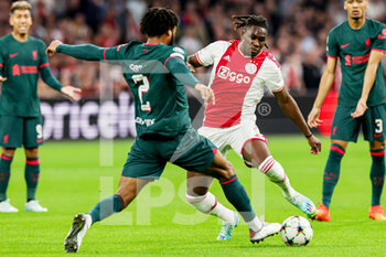 2022-10-26 - Joe Gomez of Liverpool FC, Calvin Bassey of Ajax during the UEFA Champions League, Group A football match between Ajax and Liverpool on October 26, 2022 at Johan Cruijff ArenA in Amsterdam, Netherlands - FOOTBALL - CHAMPIONS LEAGUE - AJAX V LIVERPOOL - UEFA CHAMPIONS LEAGUE - SOCCER