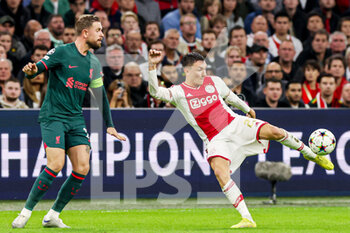 2022-10-26 - Steven Berghuis of Ajax, Jordan Henderson of Liverpool during the UEFA Champions League, Group A football match between Ajax and Liverpool on October 26, 2022 at Johan Cruijff ArenA in Amsterdam, Netherlands - FOOTBALL - CHAMPIONS LEAGUE - AJAX V LIVERPOOL - UEFA CHAMPIONS LEAGUE - SOCCER