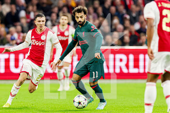 2022-10-26 - Steven Berghuis of Ajax, Mohamed Salah of Liverpool during the UEFA Champions League, Group A football match between Ajax and Liverpool on October 26, 2022 at Johan Cruijff ArenA in Amsterdam, Netherlands - FOOTBALL - CHAMPIONS LEAGUE - AJAX V LIVERPOOL - UEFA CHAMPIONS LEAGUE - SOCCER