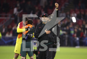 2022-10-26 - Coach of Liverpool Jurgen Klopp celebrates the victory with the supporters following the UEFA Champions League, Group A football match between Ajax Amsterdam and Liverpool FC on October 26, 2022 at Johan Cruijff ArenA in Amsterdam, Netherlands - FOOTBALL - CHAMPIONS LEAGUE - AJAX V LIVERPOOL - UEFA CHAMPIONS LEAGUE - SOCCER