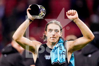 2022-11-01 - Casper Nielsen of Club Brugge KV celebrates with the man of the match trophy at full time during the UEFA Champions League, Group B football match between Bayer 04 Leverkusen and Club Brugge KV on November 1, 2022 at the BayArena in Leverkusen, Germany - FOOTBALL - CHAMPIONS LEAGUE - BAYER LEVERKUSEN V CLUB BRUGGE - UEFA CHAMPIONS LEAGUE - SOCCER