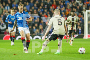 2022-11-01 - Scott Arfield of Rangers and Kenneth Taylor of Ajax during the UEFA Champions League, Group A football match between Rangers and Ajax on November 1, 2022 at Ibrox stadium in Glasgow, Scotland - FOOTBALL - CHAMPIONS LEAGUE - RANGERS V AJAX - UEFA CHAMPIONS LEAGUE - SOCCER