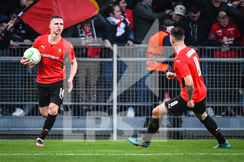 2022-03-17 - Benjamin BOURIGEAUD of Rennes celebrate his goal with Baptiste SANTAMARIA of Rennes during the UEFA Conference League, Round of 16, 2nd leg football match between Stade Rennais (Rennes) and Leicester City on March 17, 2022 at Roazhon Park in Rennes, France - STADE RENNAIS (RENNES) VS LEICESTER CITY - UEFA CONFERENCE LEAGUE - SOCCER