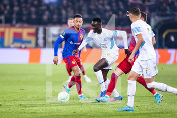 2022-03-17 - BASEL, SWITZERLAND - MARCH 17: Pape Gueye of Marseille (R) against Liam Millar of Basel (L) during the UEFA Conference League Round of 16 Leg Two match between FC Basel and Olympique Marseille at  on March 17, 2022 in Basel, Switzerland. - FC BASEL AND OLYMPIQUE MARSEILLE - UEFA CONFERENCE LEAGUE - SOCCER