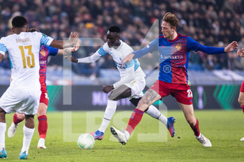 2022-03-17 - BASEL, SWITZERLAND - MARCH 17: Pape Gueye of Marseille (L) against Wouter Burger of Basel (R) during the UEFA Conference League Round of 16 Leg Two match between FC Basel and Olympique Marseille at  on March 17, 2022 in Basel, Switzerland. - FC BASEL AND OLYMPIQUE MARSEILLE - UEFA CONFERENCE LEAGUE - SOCCER