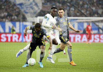 2022-05-05 - Bamba Dieng of Marseille between Tyrell Malacia and Orkun Kokcu of Feyenoord during the UEFA Europa Conference League semi-final second leg football match between Olympique de Marseille (OM) and Feyenoord Rotterdam on May 5, 2022 at Stade Velodrome in Marseille, France - OLYMPIQUE DE MARSEILLE (OM) VS FEYENOORD ROTTERDAM - UEFA CONFERENCE LEAGUE - SOCCER