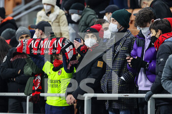 2022-01-13 - Fans wearing masks seen inside the stadium during the Coppa Italia 2021/22 football match between AC Milan and Genoa CFC at Giuseppe Meazza Stadium, Milan, Italy on January 13, 2022 - AC MILAN VS GENOA CFC - ITALIAN CUP - SOCCER
