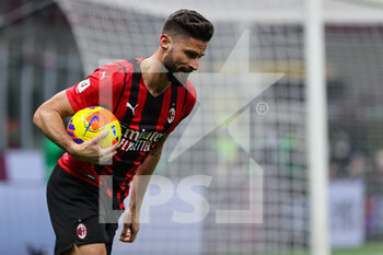 2022-01-13 - Olivier Giroud of AC Milan celebrates after scoring a goal during the Coppa Italia 2021/22 football match between AC Milan and Genoa CFC at Giuseppe Meazza Stadium, Milan, Italy on January 13, 2022 - AC MILAN VS GENOA CFC - ITALIAN CUP - SOCCER